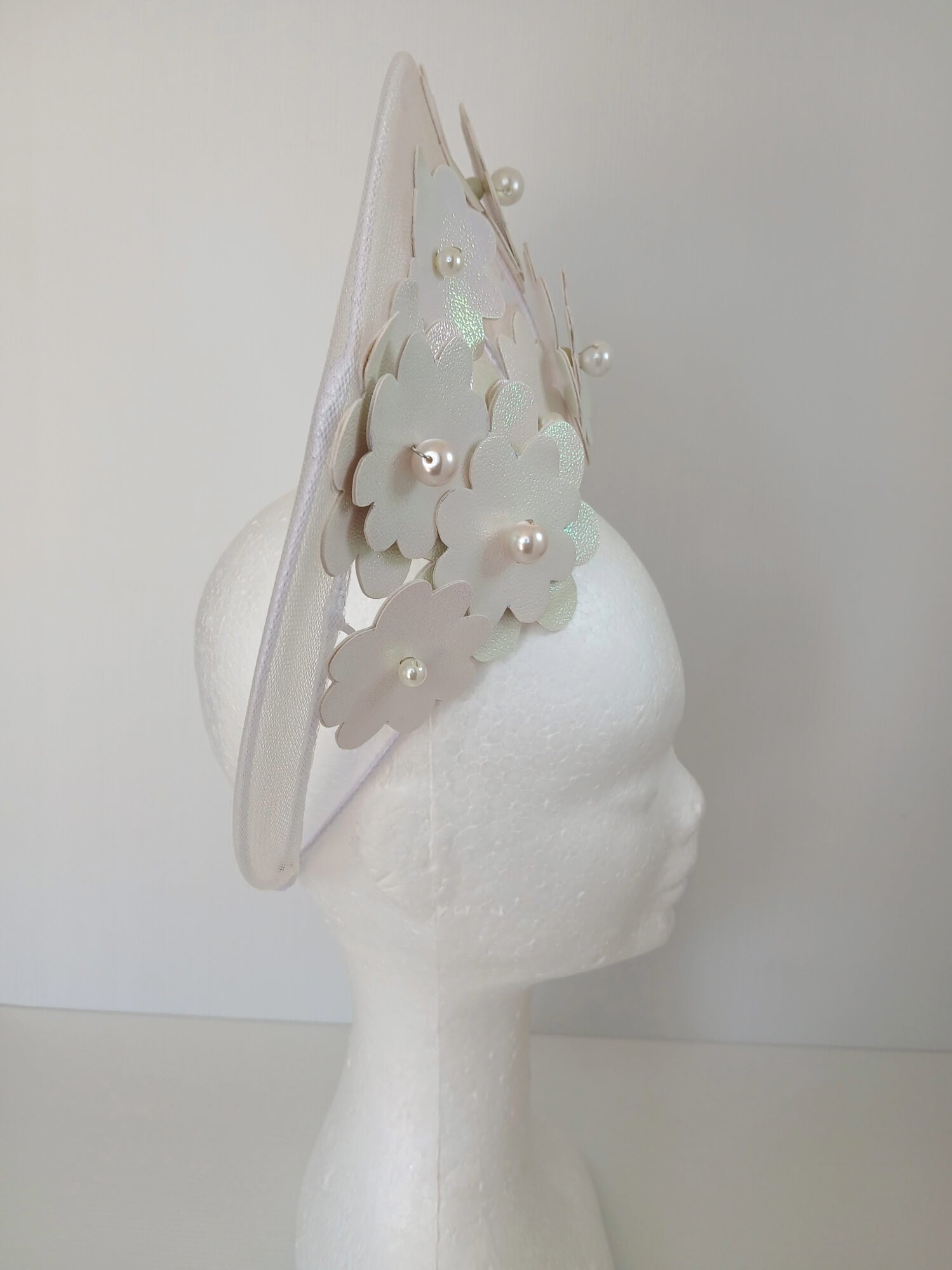 A picture of a White Pleather and Crinoline Millinery Halo Crown by Melissa Rath Millinery.