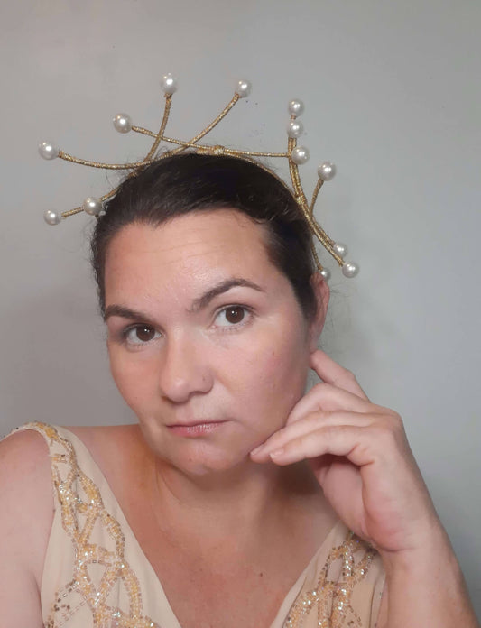 A picture of a cream and gold beaded millinery headband by Melissa Rath Millinery.