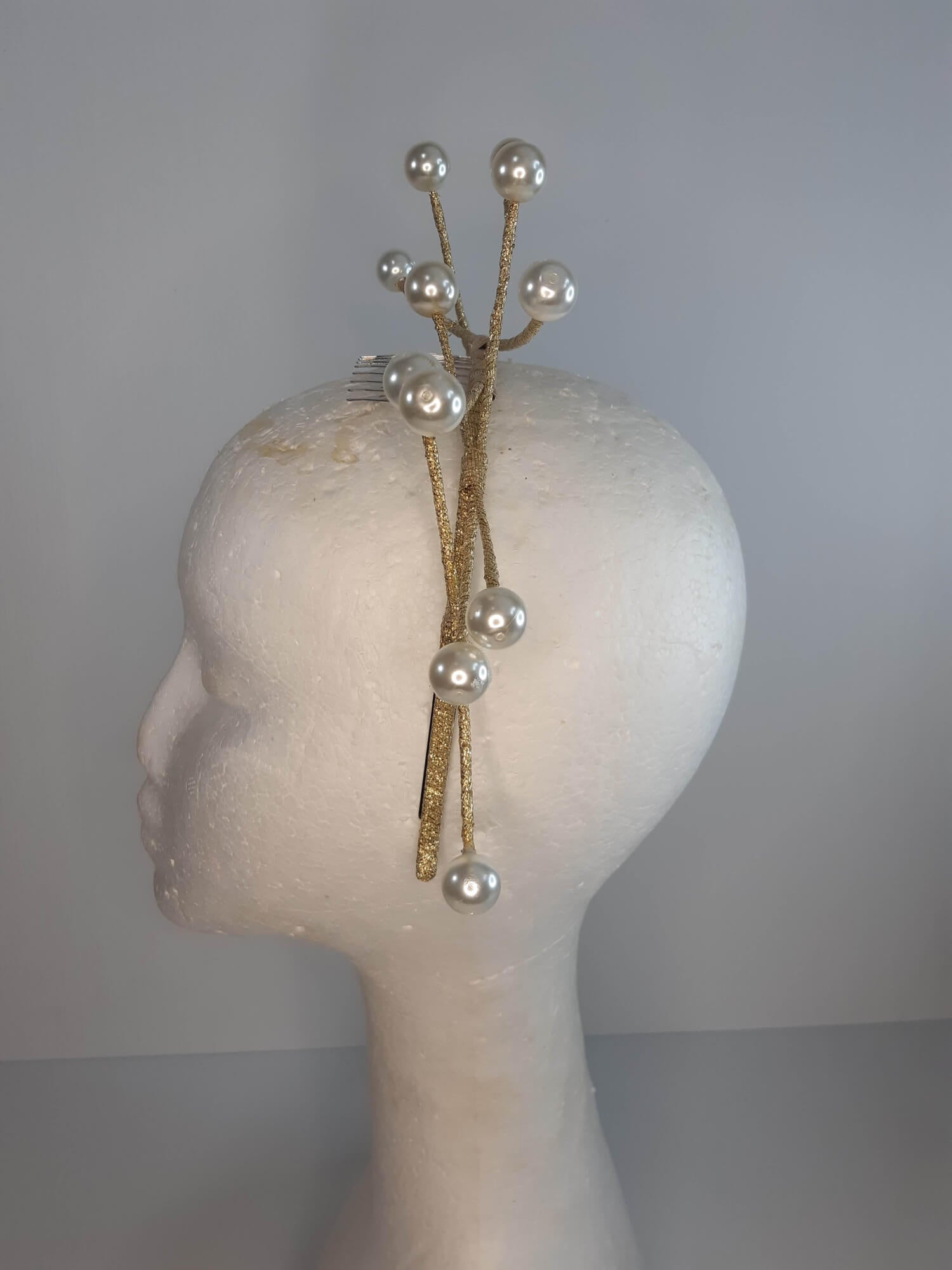 A picture of a cream and gold beaded millinery headband by Melissa Rath Millinery.