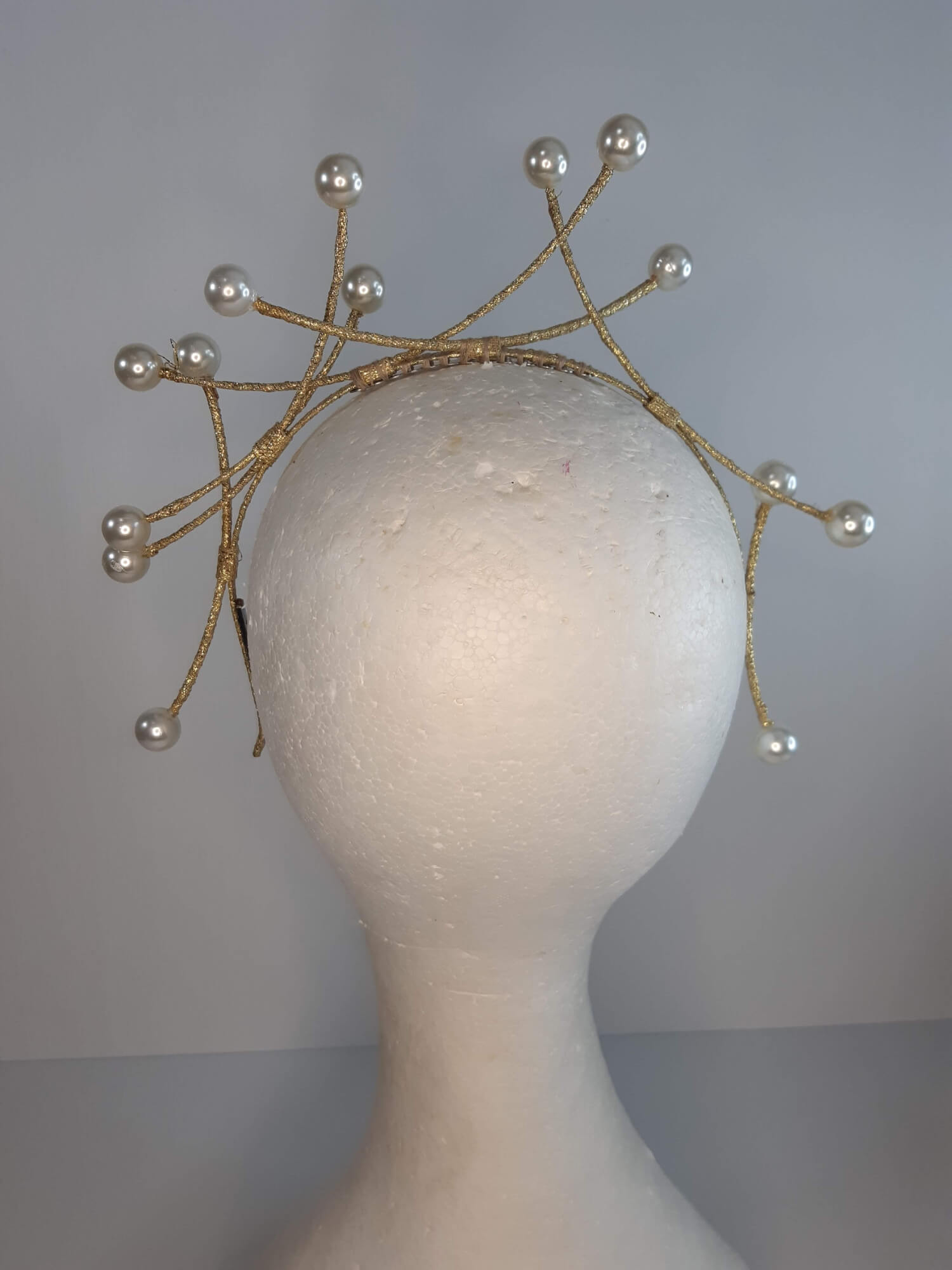 A picture of a cream and gold beaded millinery headband by Melissa Rath Millinery.
