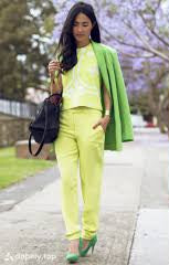 A picture of a woman wearing an outfit in a yellow analogous colour scheme.