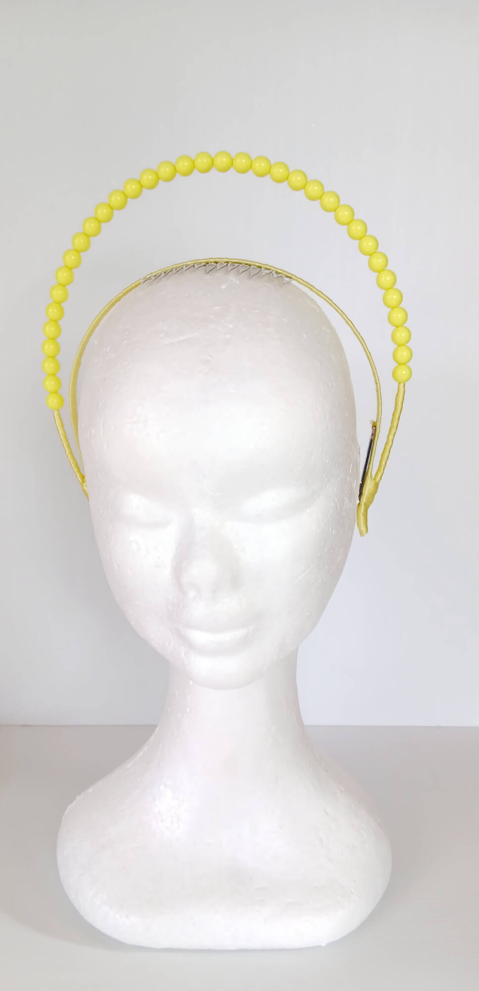 A picture of a Yellow Beaded Headband by Melissa Rath Millinery
