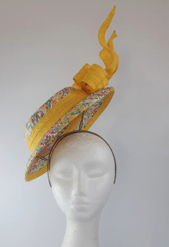 A picture of a Yellow Floating Boater Hat  by Melissa Rath Millinery.