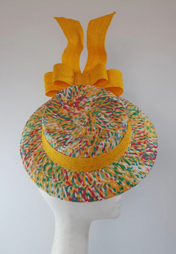 A picture of a Yellow Floating Boater Hat  by Melissa Rath Millinery.