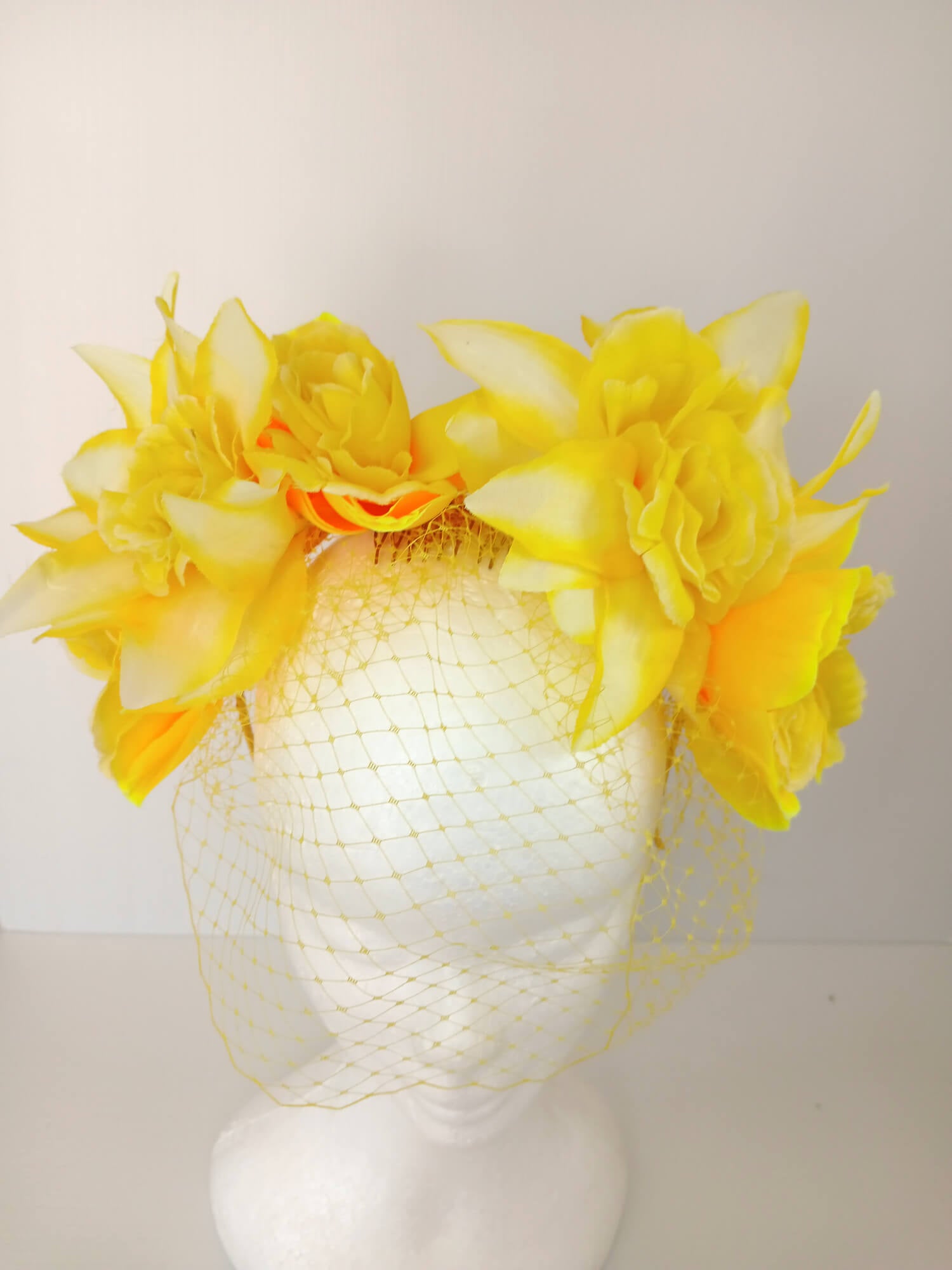 A picture of a Yellow Veiled Headband by Melissa Rath Millinery