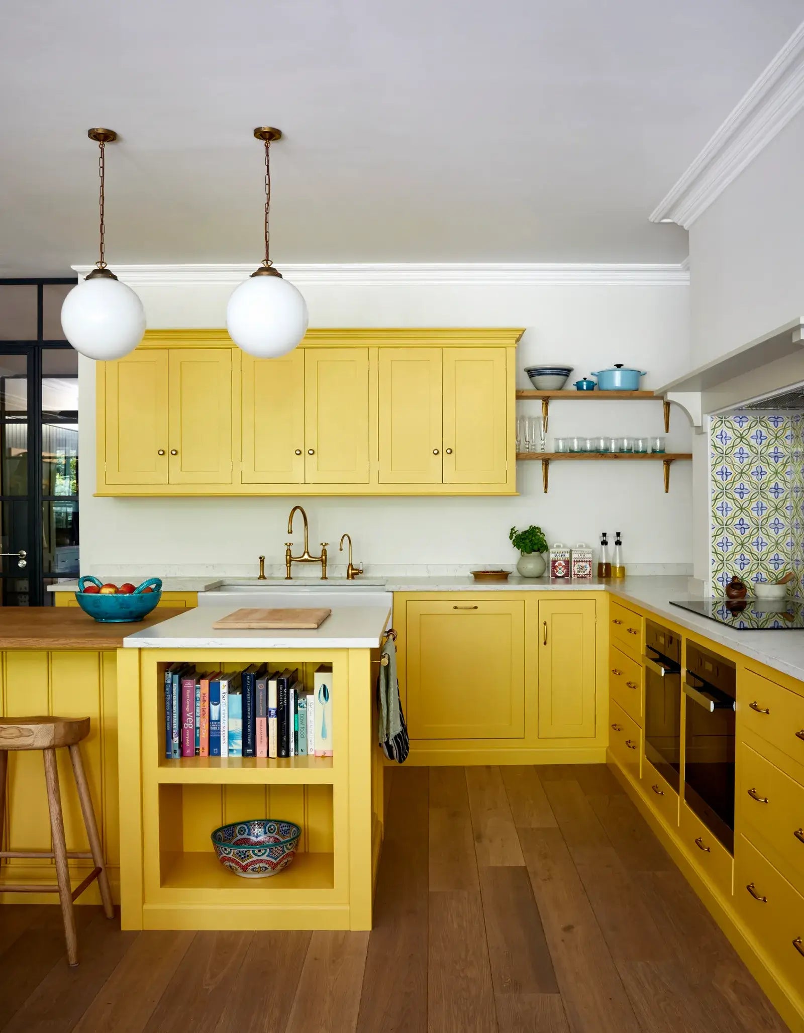 A picture of a bright yellow kitchen.