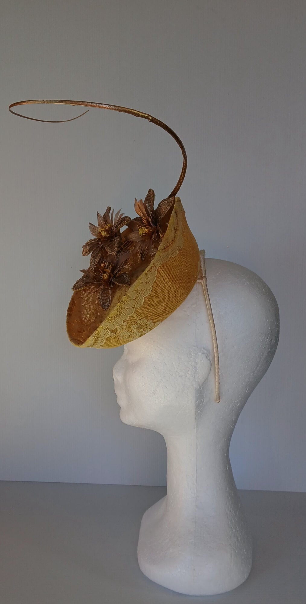 A picture of a Yellow Millinery Saucer Hat by Melissa Rath Millinery.