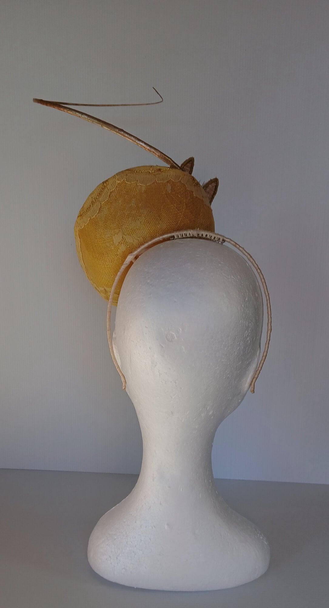 A picture of a Yellow Millinery Saucer Hat by Melissa Rath Millinery.