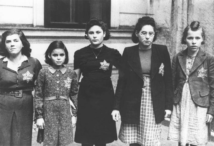 An image of Jewish people wearing a yellow star during WWII