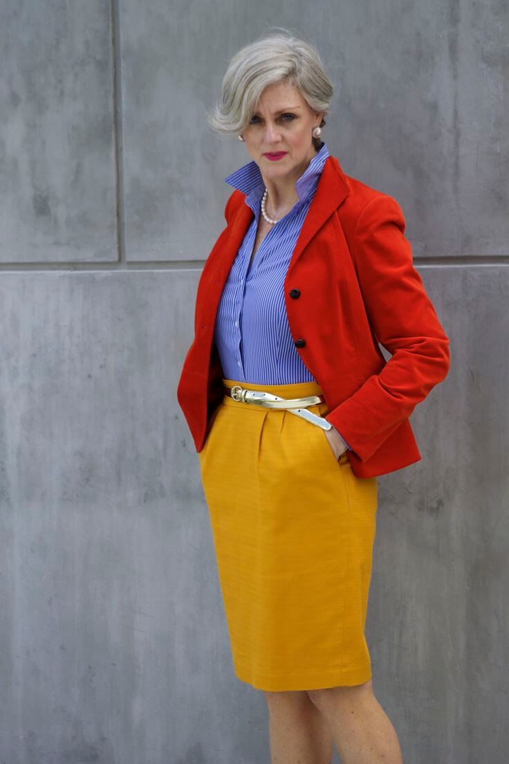 A picture of a woman wearing an outfit in a yellow triadic colour scheme.