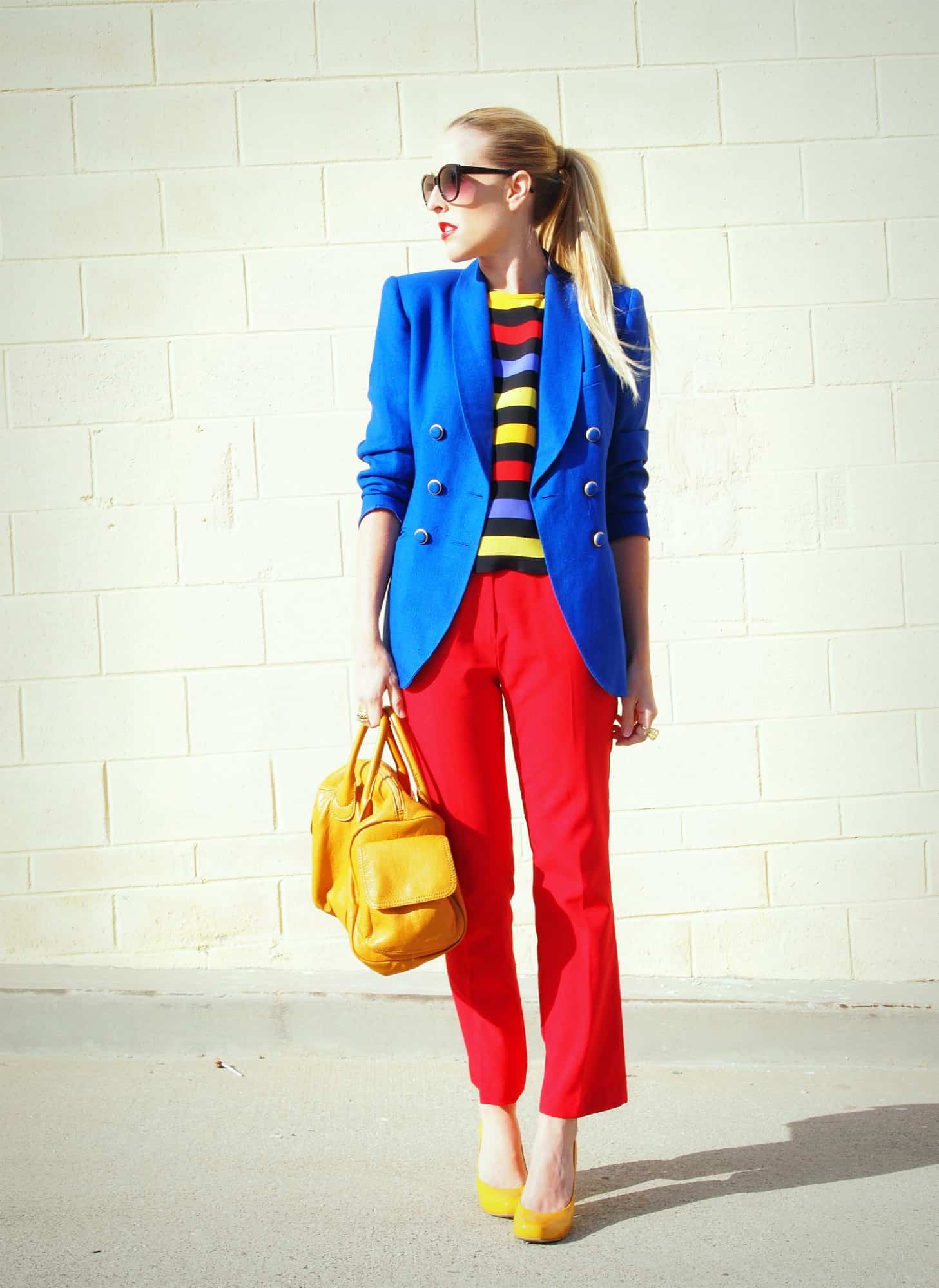 A picture of a woman wearing an outfit in a yellow triadic colour scheme.