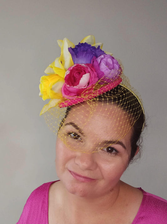 A picture of a Yellow, Pink and Purple Millinery Fascinator by Melissa Rath Millinery.