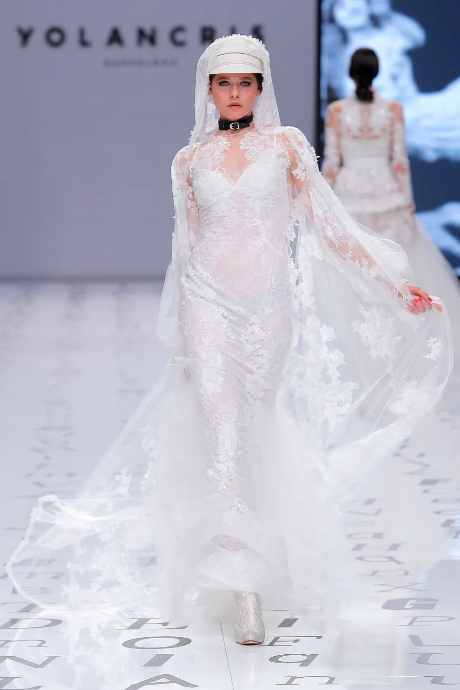 A picture of a model on the catwalk for the Yolan Cris Bridal 2020 catwalk show.