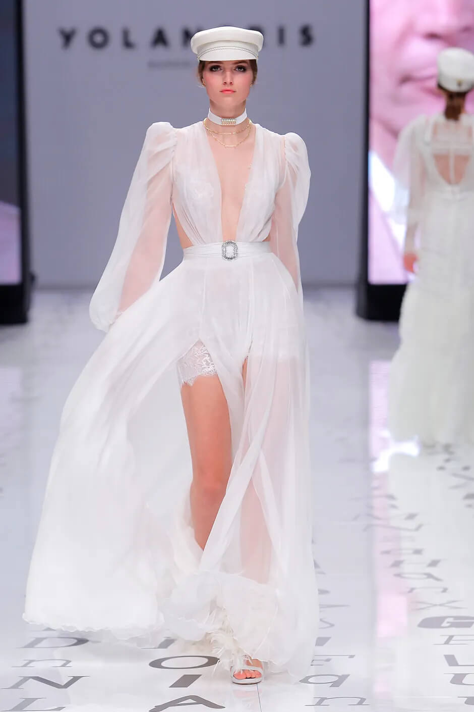 A picture of a model on the catwalk for the Yolan Cris Bridal 2020 catwalk show.