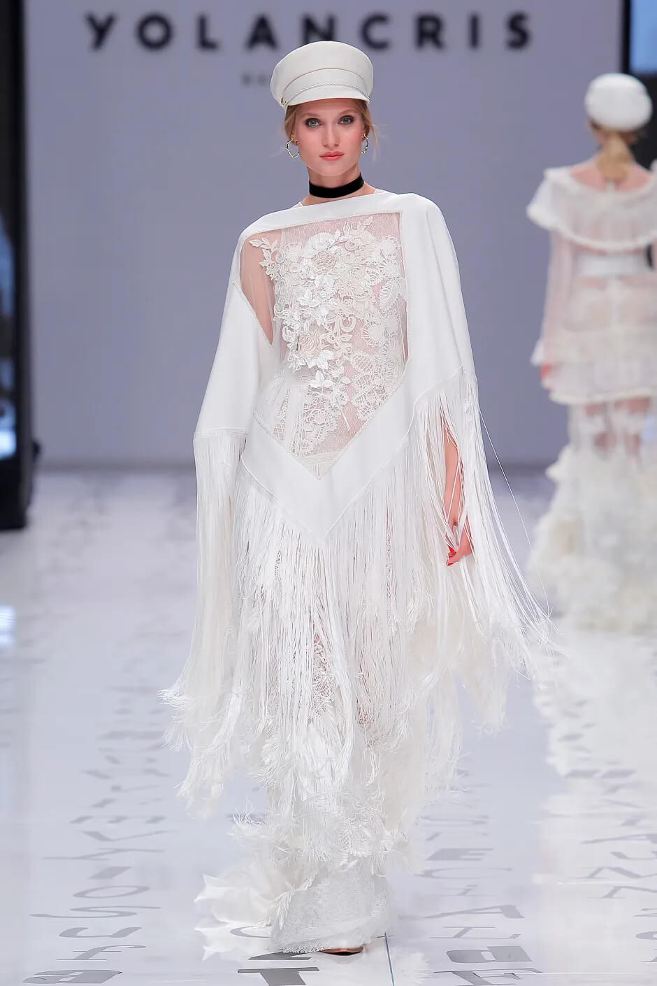 A picture of a model on the catwalk for the Yolan Cris Bridal 2020 catwalk show.