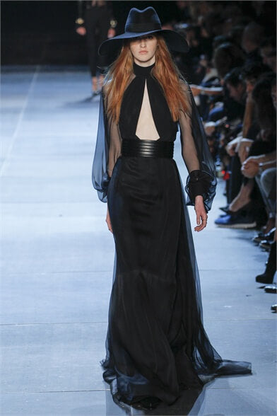 A picture of a model on the catwalk for Yves Saint Laurent 2013.