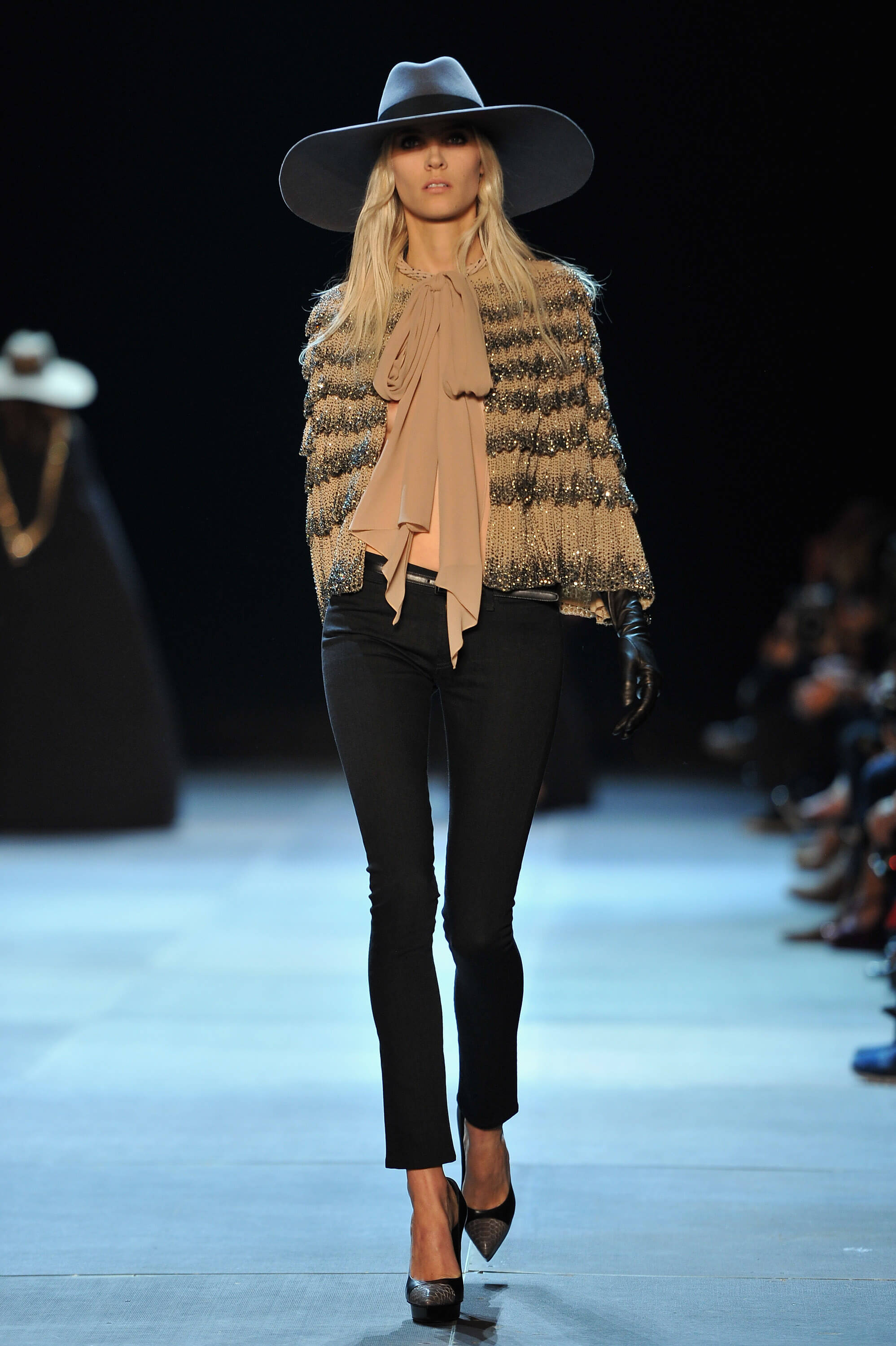 A picture of a model on the catwalk for Yves Saint Laurent 2013.