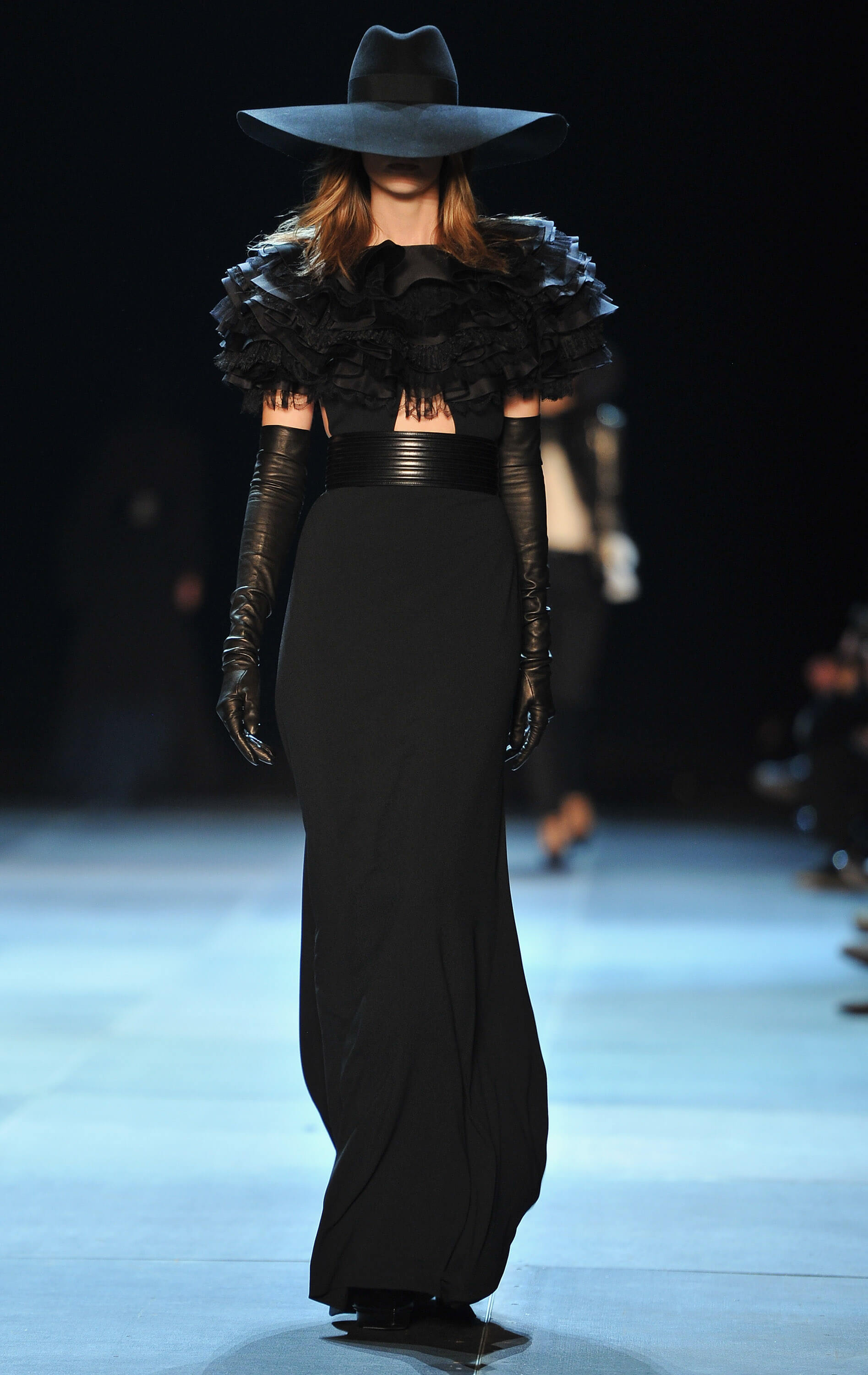 A picture of a model on the catwalk for Yves Saint Laurent 2013.