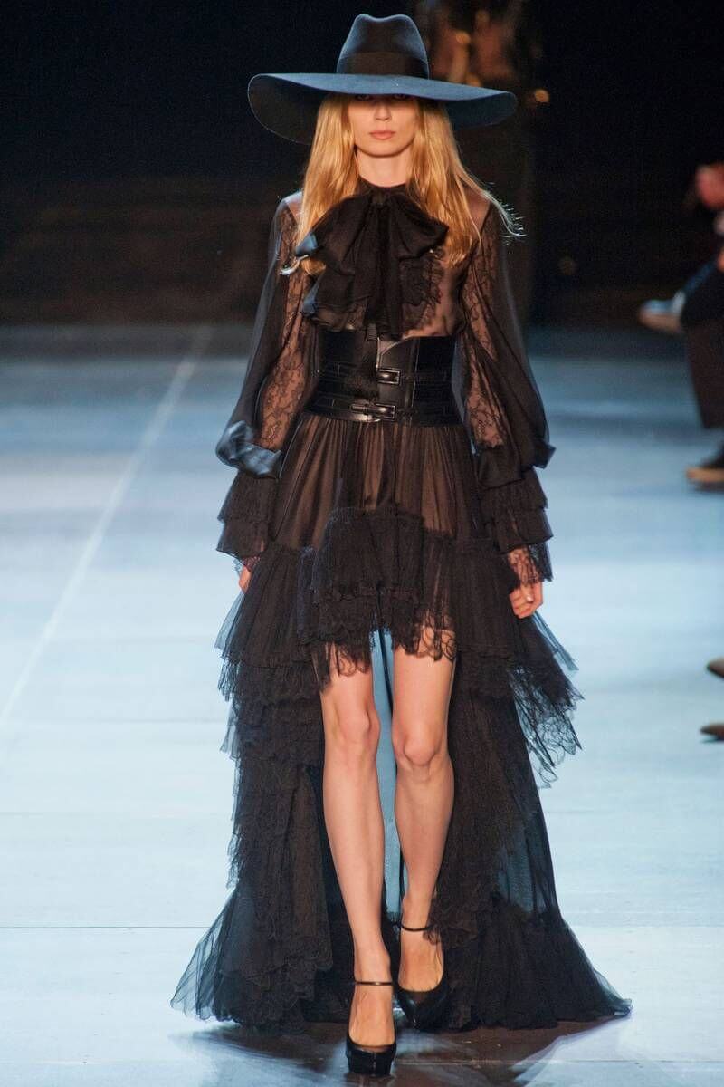 A picture of a model on the catwalk for Yves Saint Laurent 2013.
