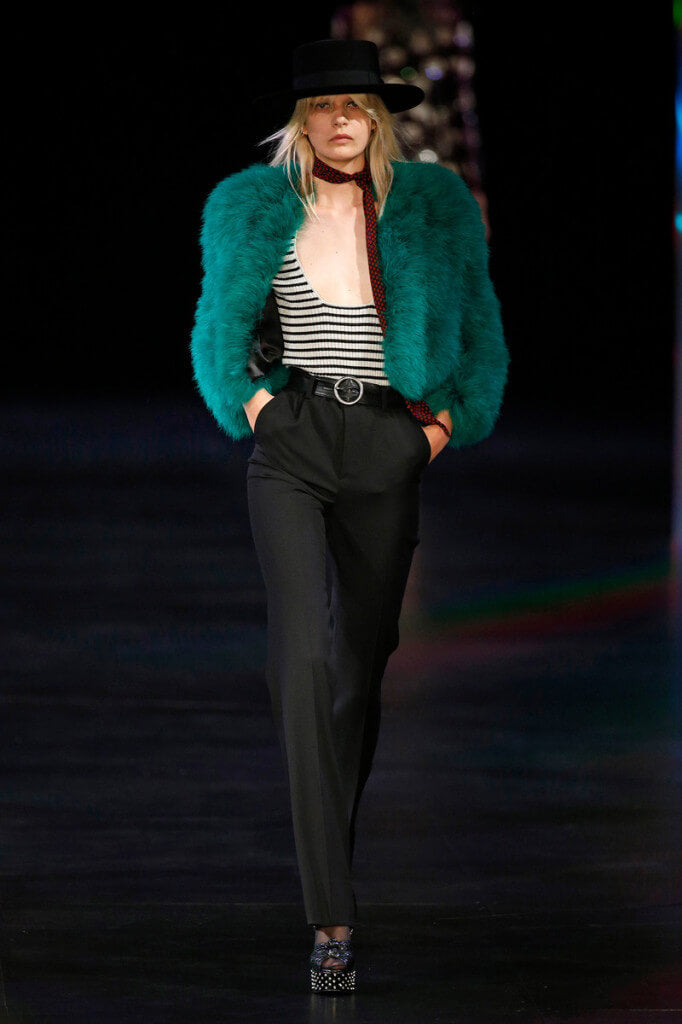 A picture of a model on the catwalk for Yves Saint Laurent 2015.
