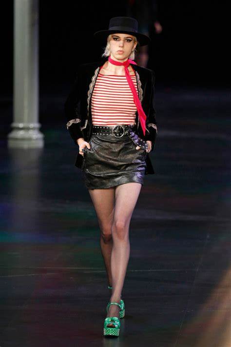 A picture of a model on the catwalk for Yves Saint Laurent 2015.