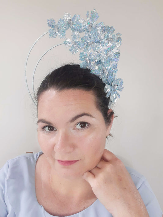 A picture of a blue pleather millinery halo crown by Melissa Rath Millinery