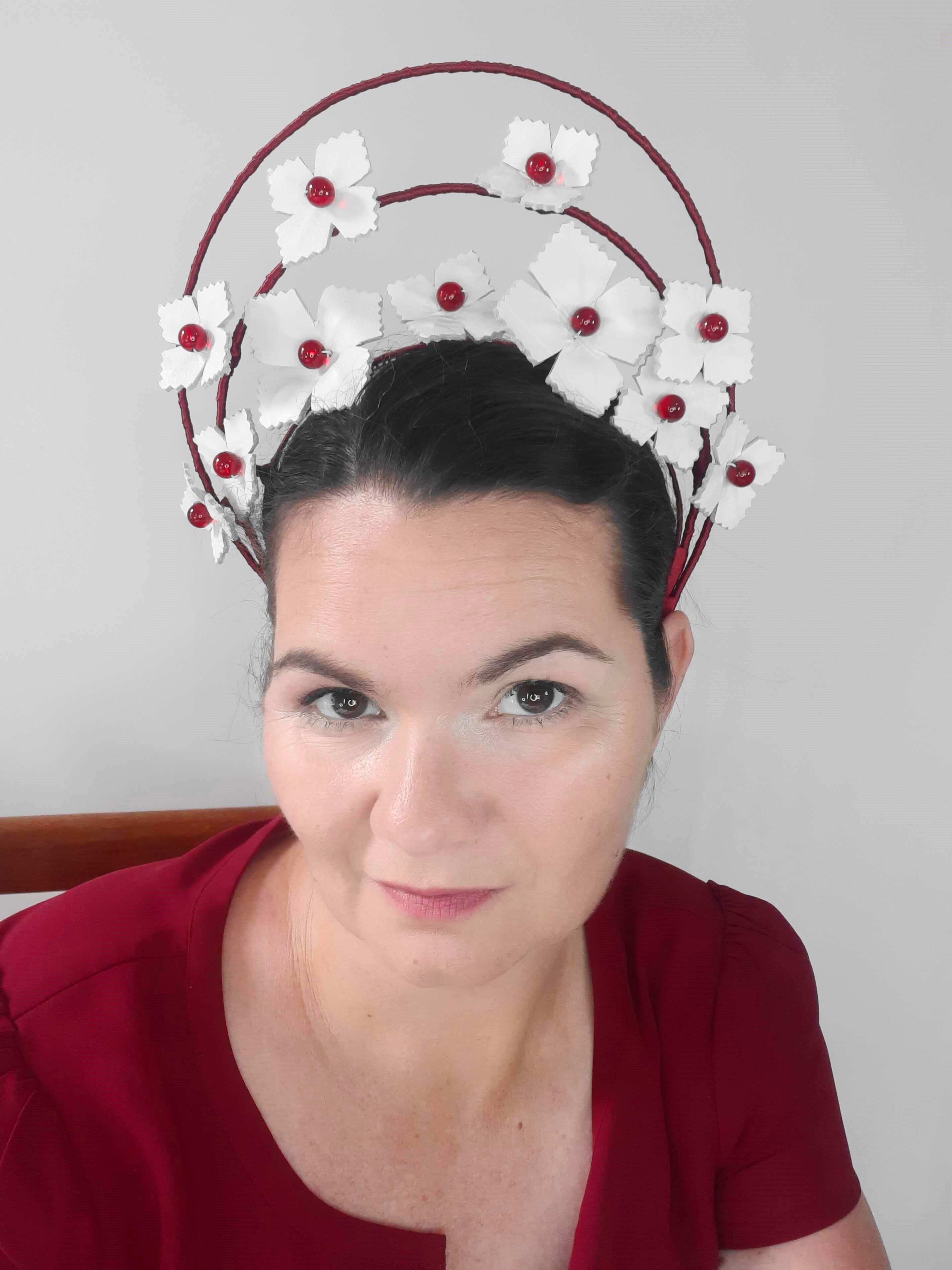 A picture of a red and white halo crown by Melissa Rath Millinery