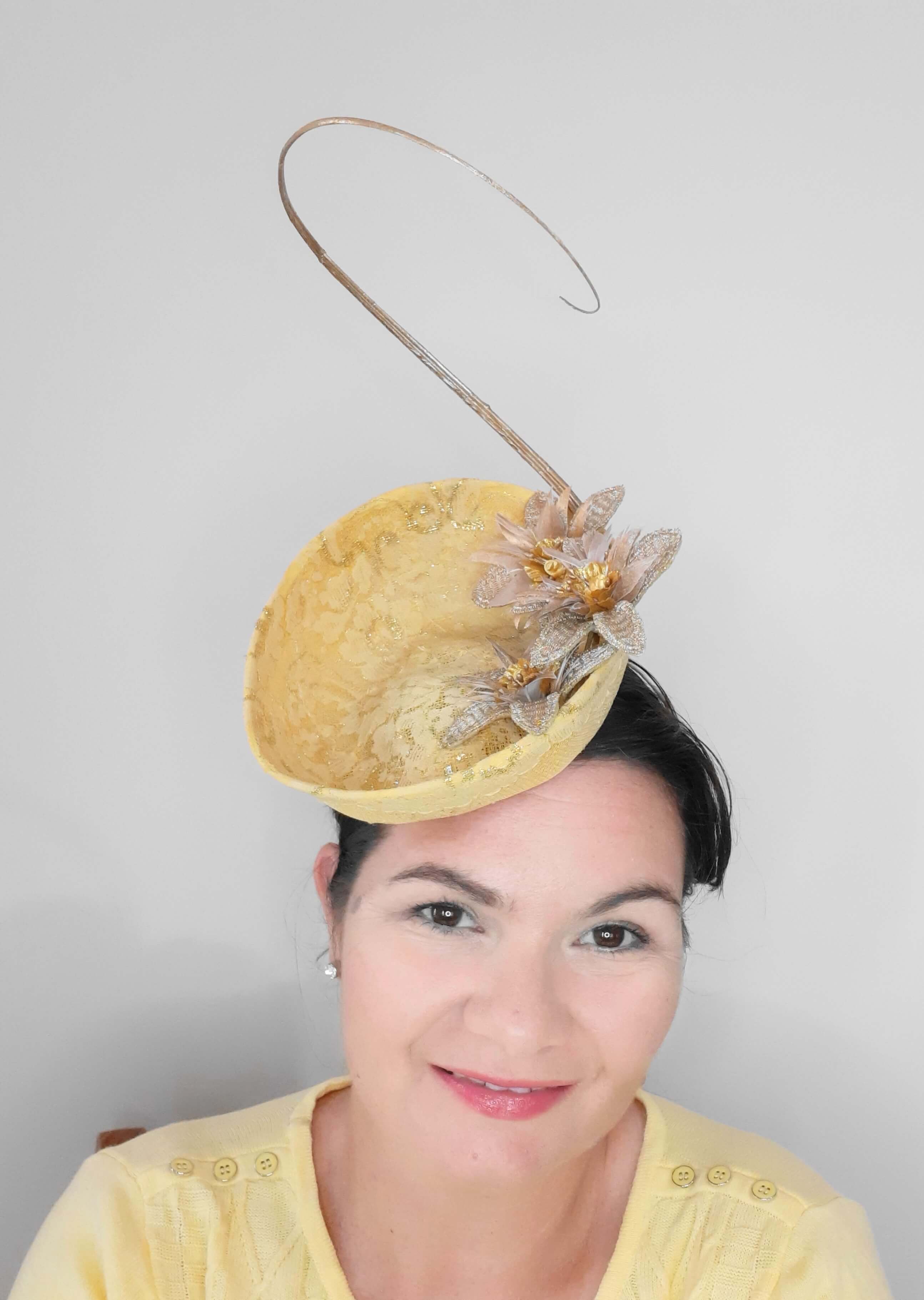 A picture of a yellow saucer hat by Melissa Rath Millinery.